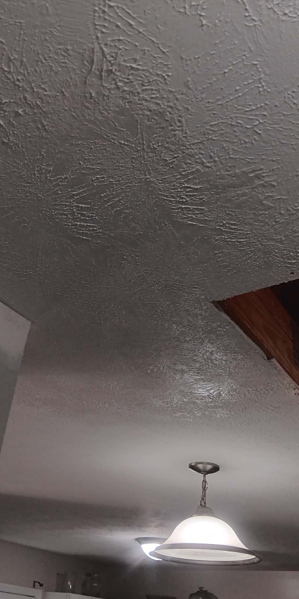 textured feathered joint compound around ceiling attic access door